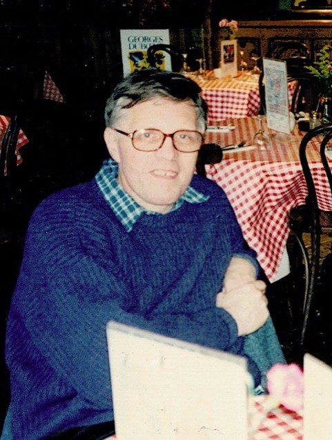 Bob Purdie seated at a restaurant table