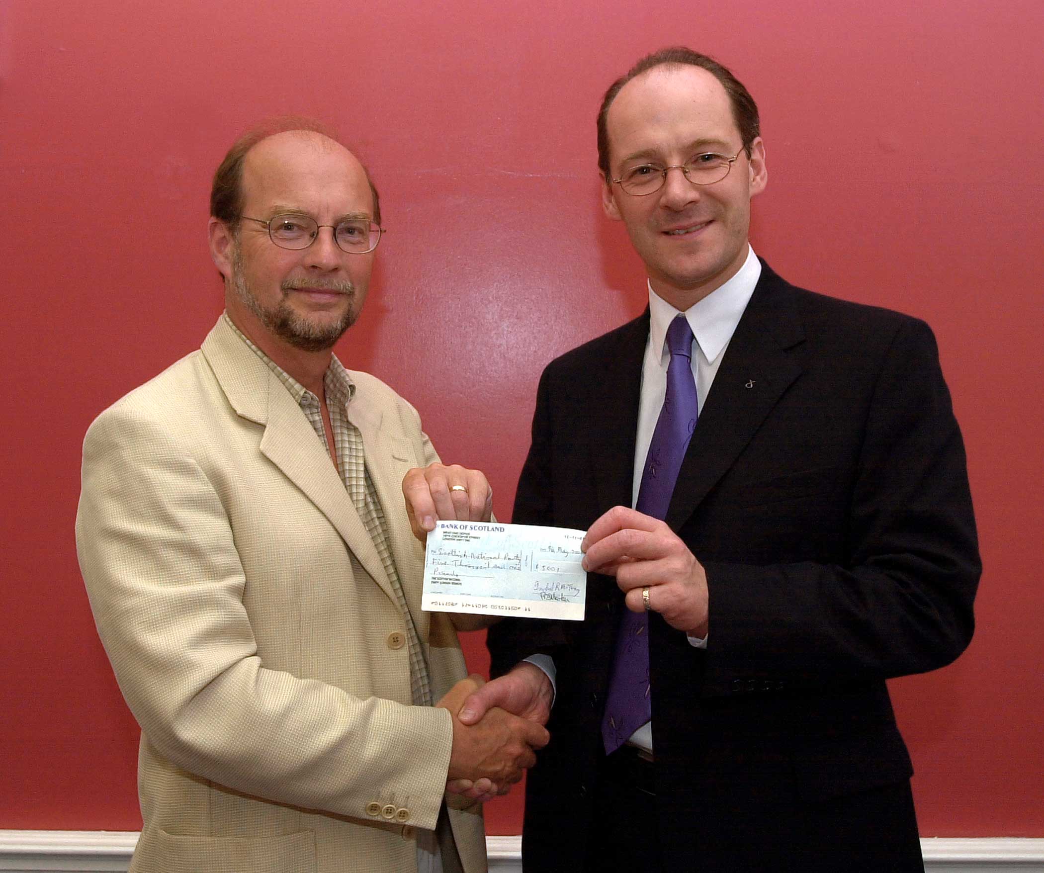 John Green presents cheque to John Swinney